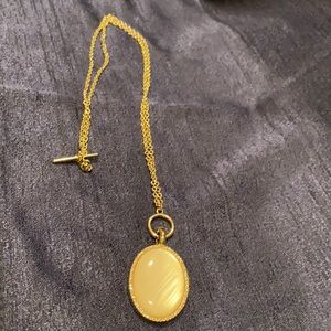 Long gold necklace with pendant